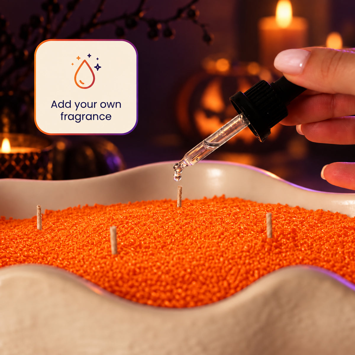 Adding a few drops of fragrance oil to orange wax pearls