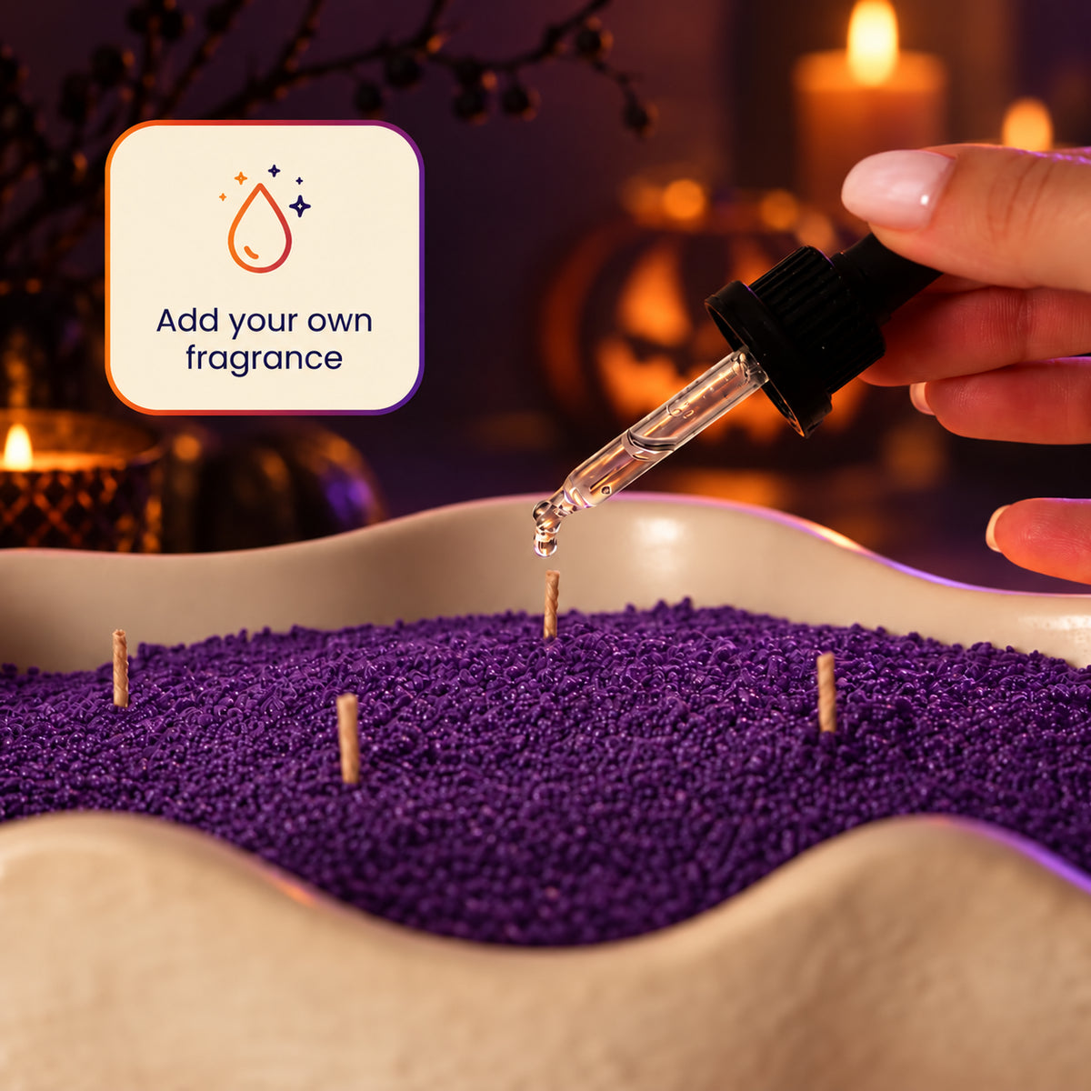 Adding a few drops of fragrance oil to purple wax pearls