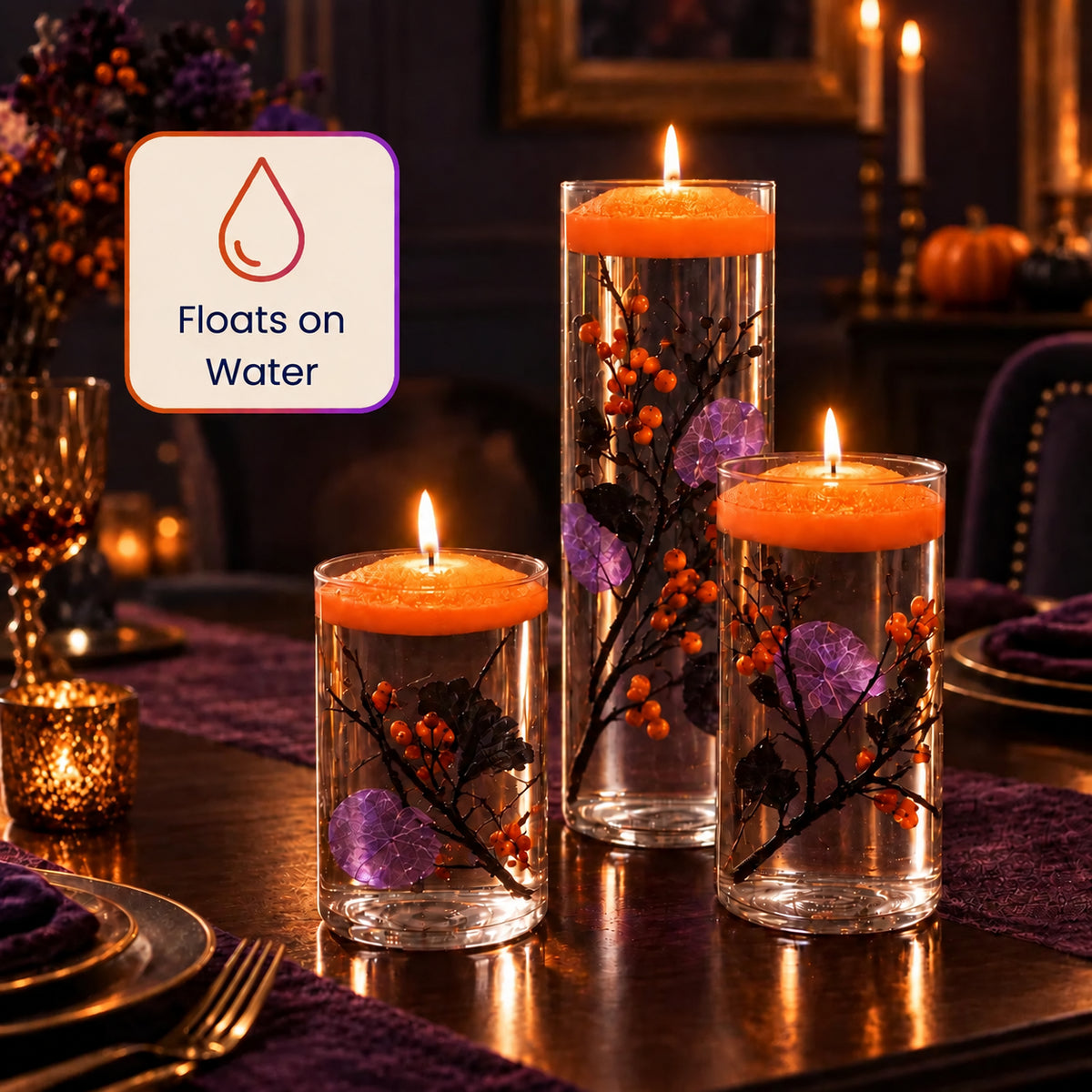 Floating orange candles in glass cylinders on a Halloween dinner table
