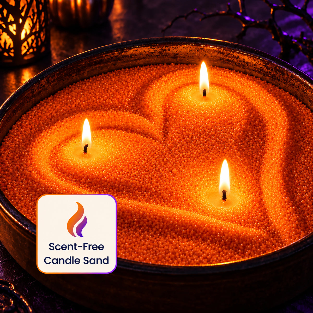 Scent-free orange candle sand shaped into a heart with three lit wicks