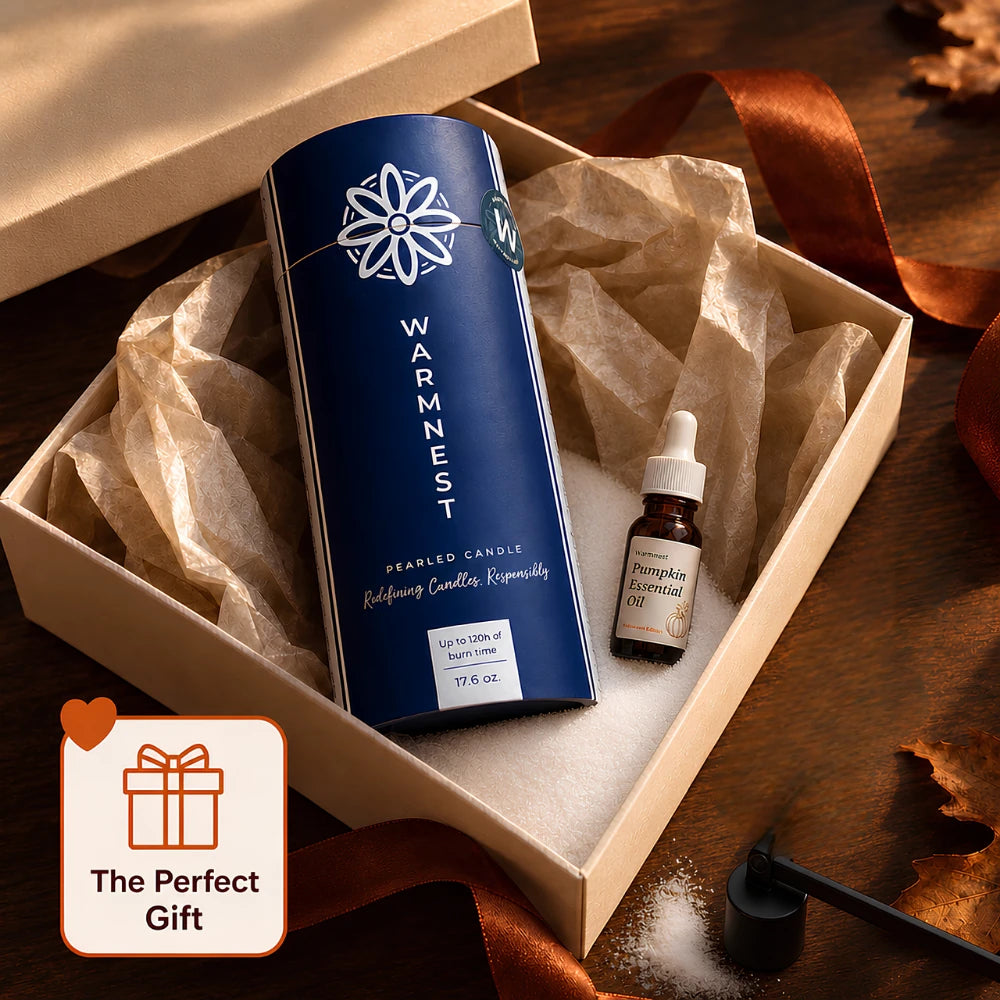 Warmnest Pearled Candle tube, pumpkin essential oil and black candle snuffer presented in an open autumn gift box